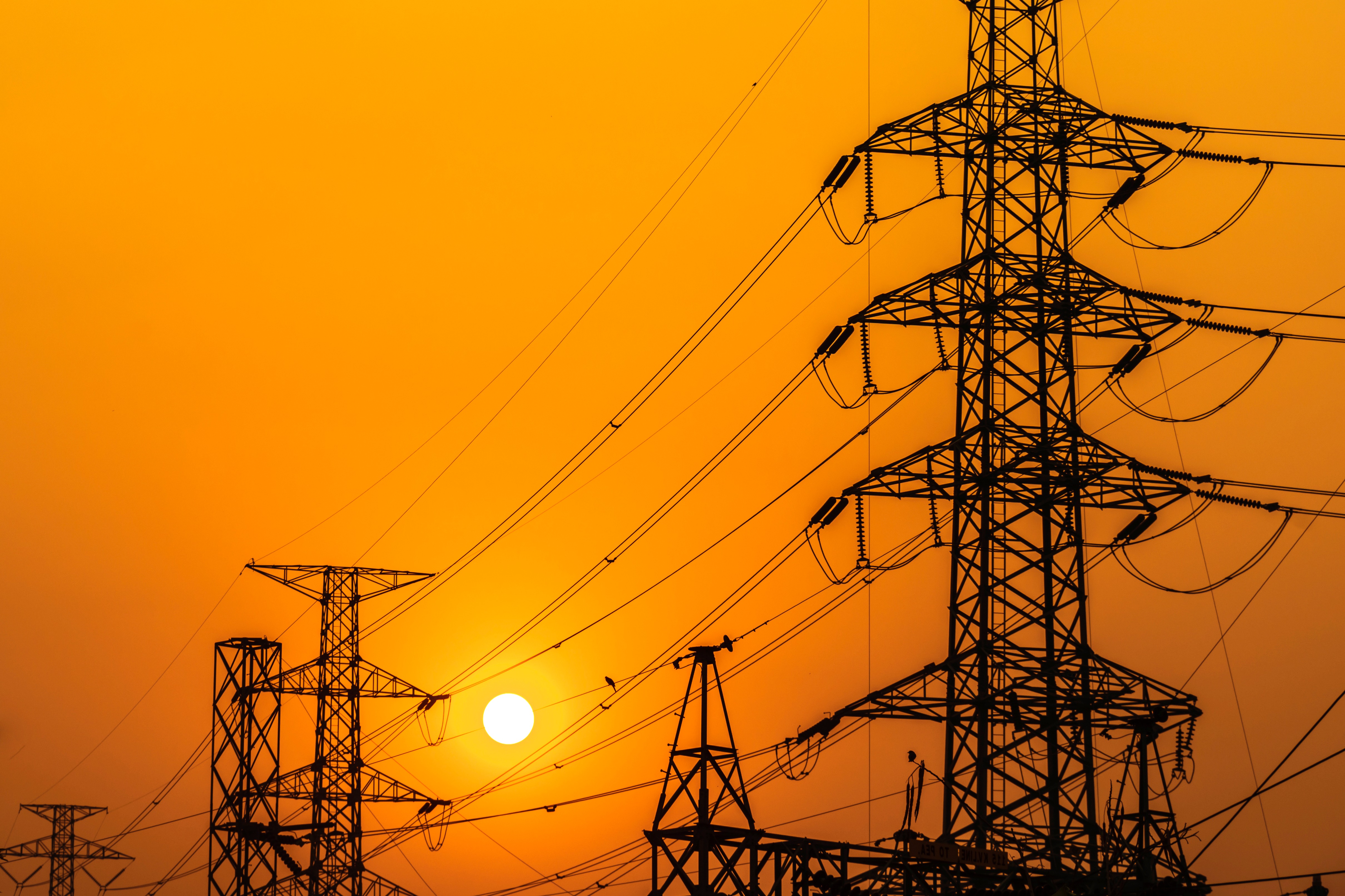 high-voltage-steel-transmission-tower-sunset.jpg